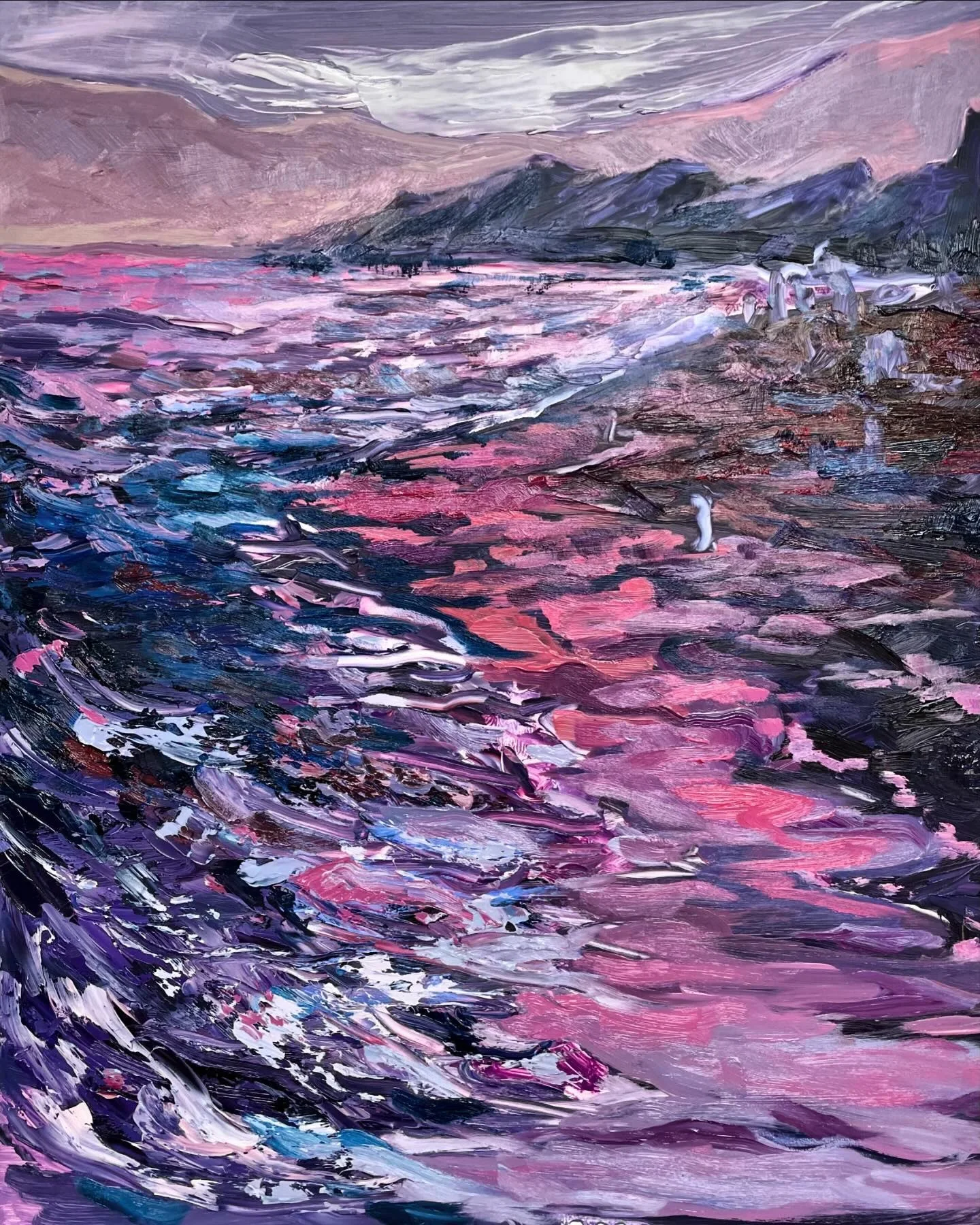Purple-toned ocean and rocky coast