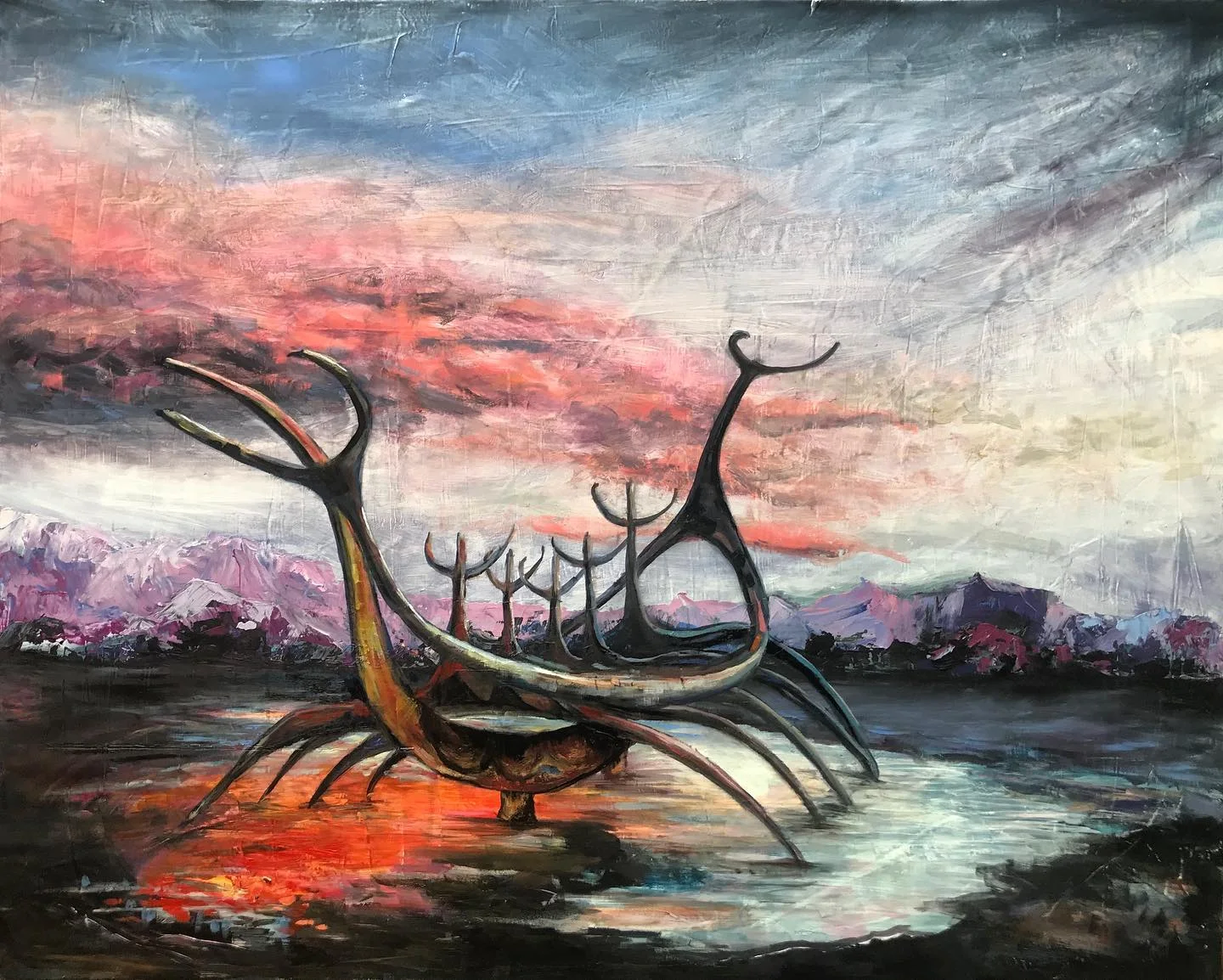 Icelandic landscape with a skeletal Viking ship sculpture